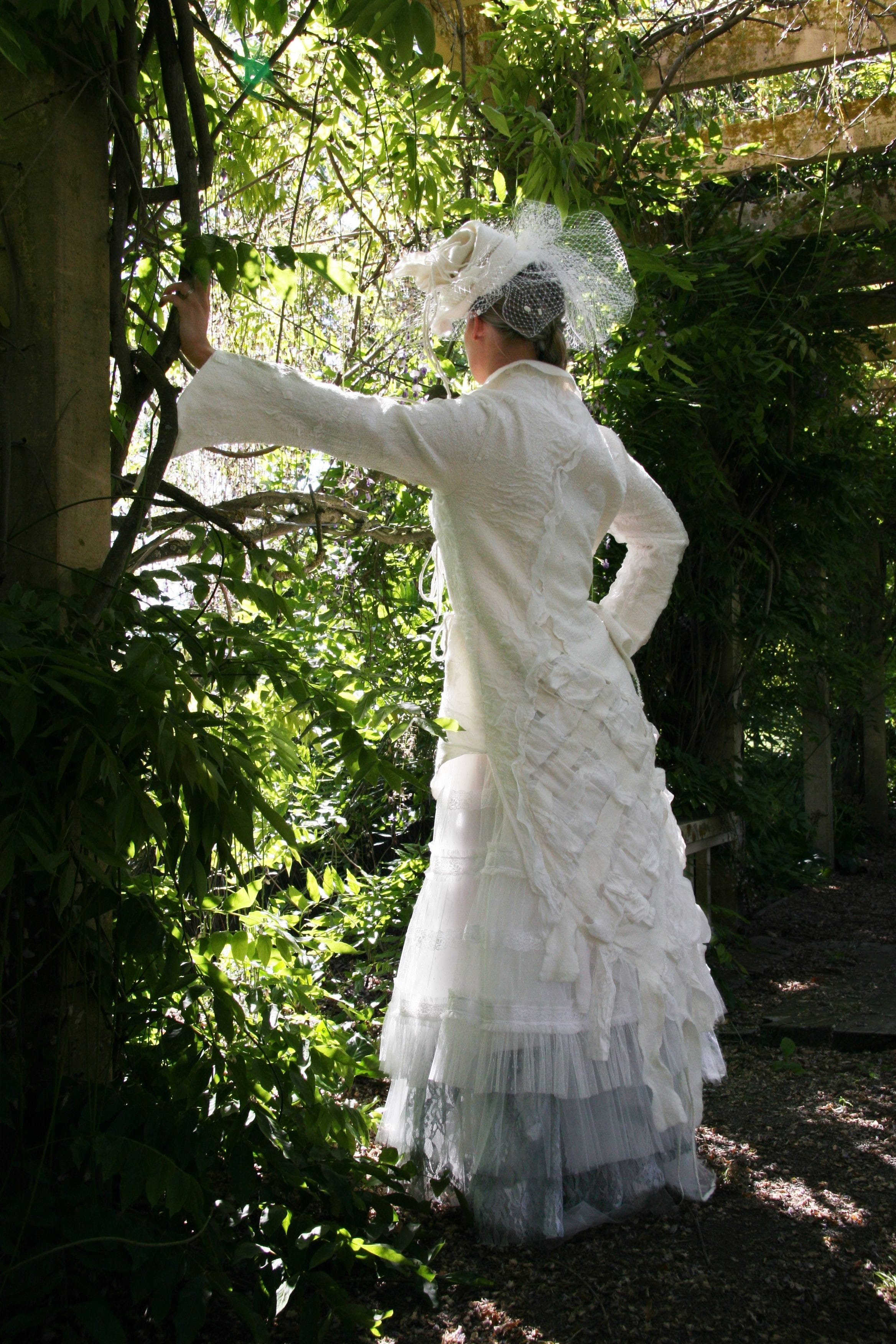 Handfelted with superfine merino and silk paj.  
The felt is woven together for a unique back.