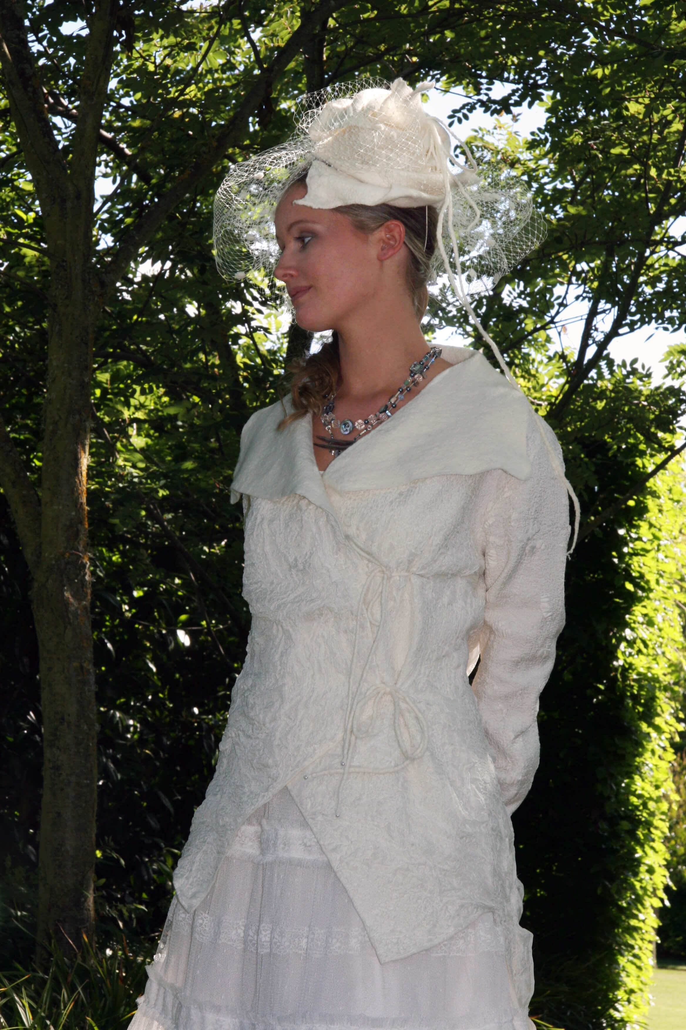 Handfelted with superfine merino and silk paj.  
The felt is woven together for a unique back.